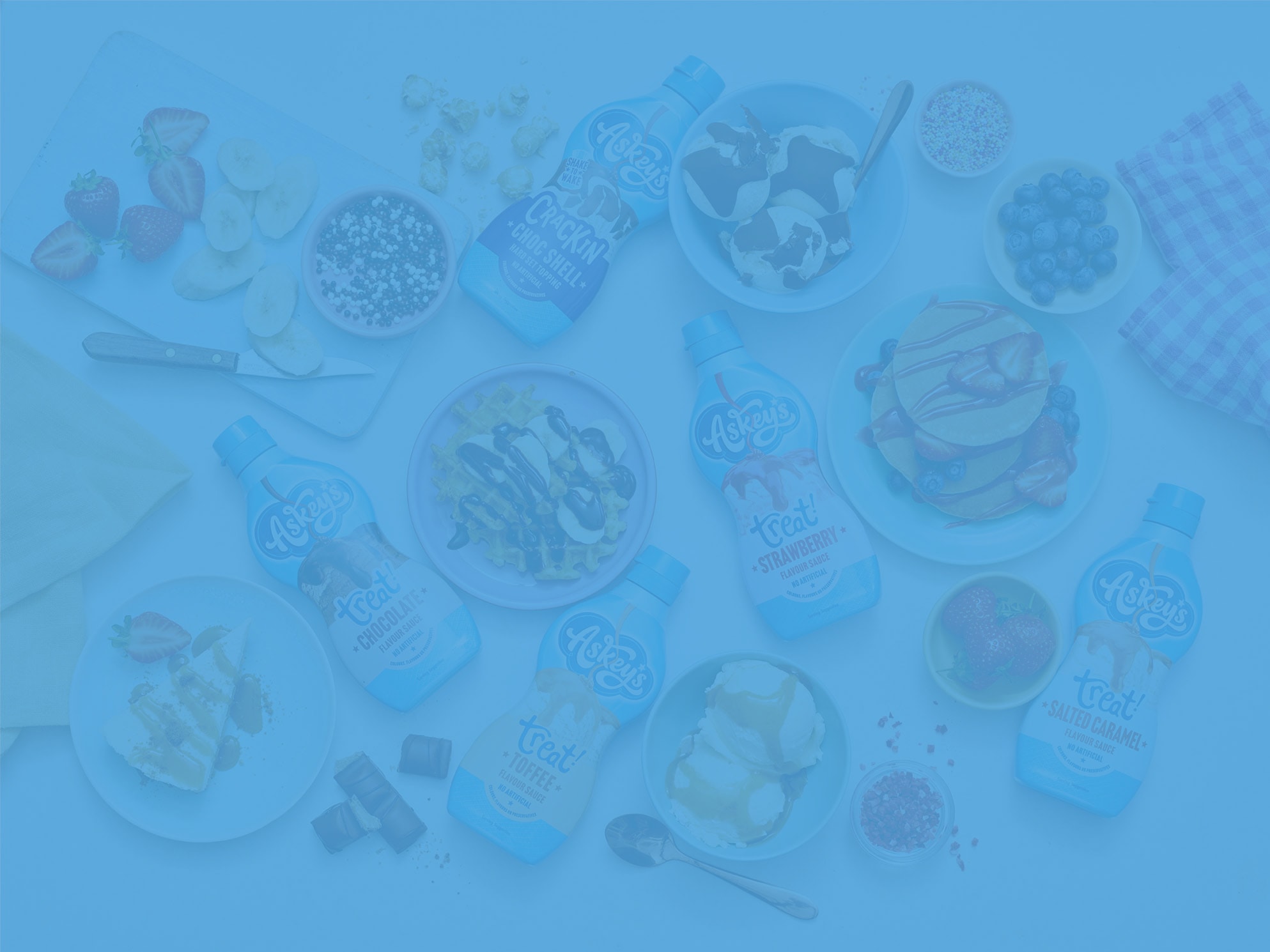 Askeys sauces on a table with a variety of desserts